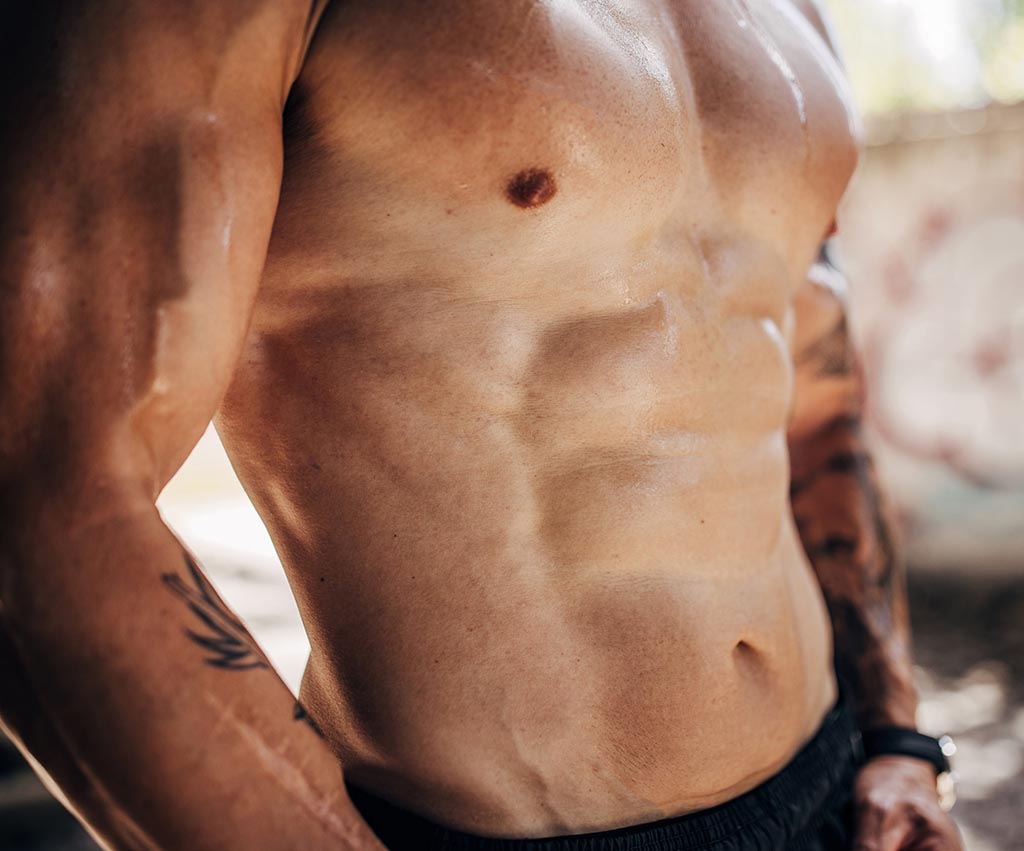 doctor examining posture after gynecomastia surgery