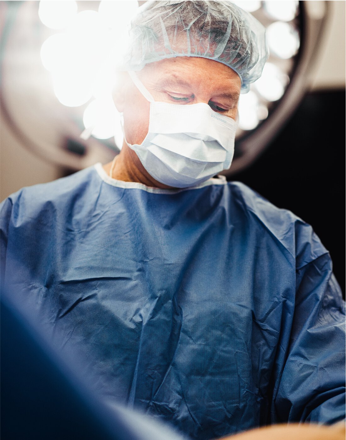 Gynecomastia surgeon performing surgery
