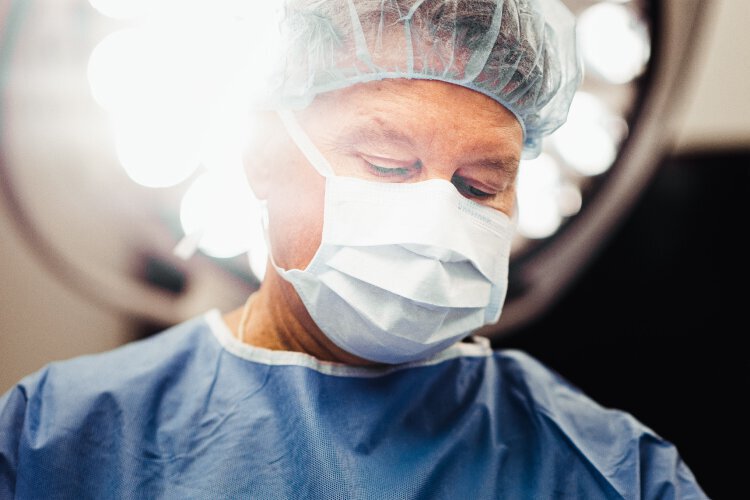 Male Breast Reduction Surgeon performing surgery